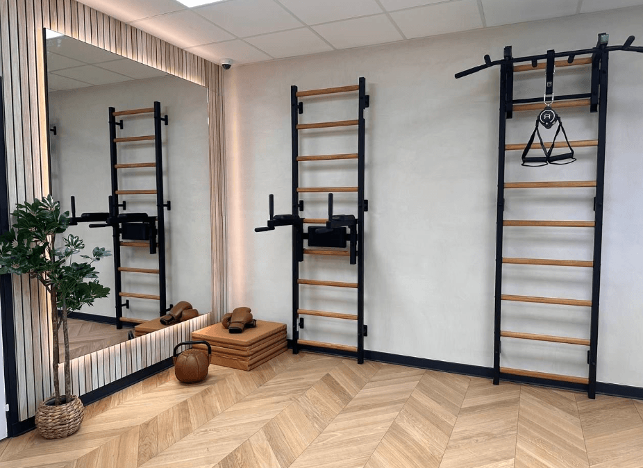 BenchK wall bars paired with Recoil Straps for suspension training