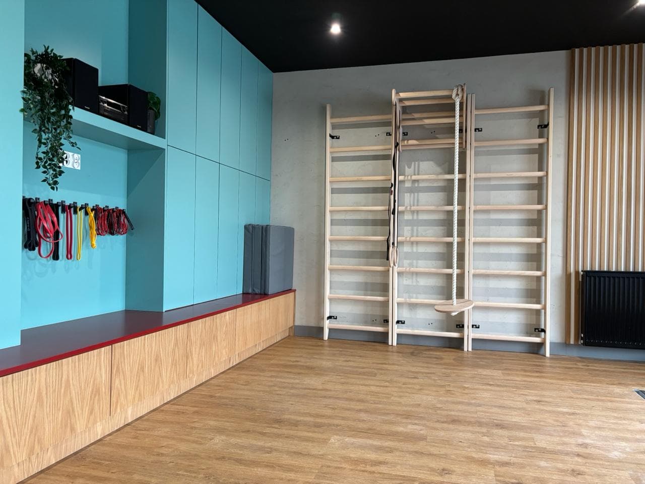 BenchK wall bars in an Xponential Fitness studio environment