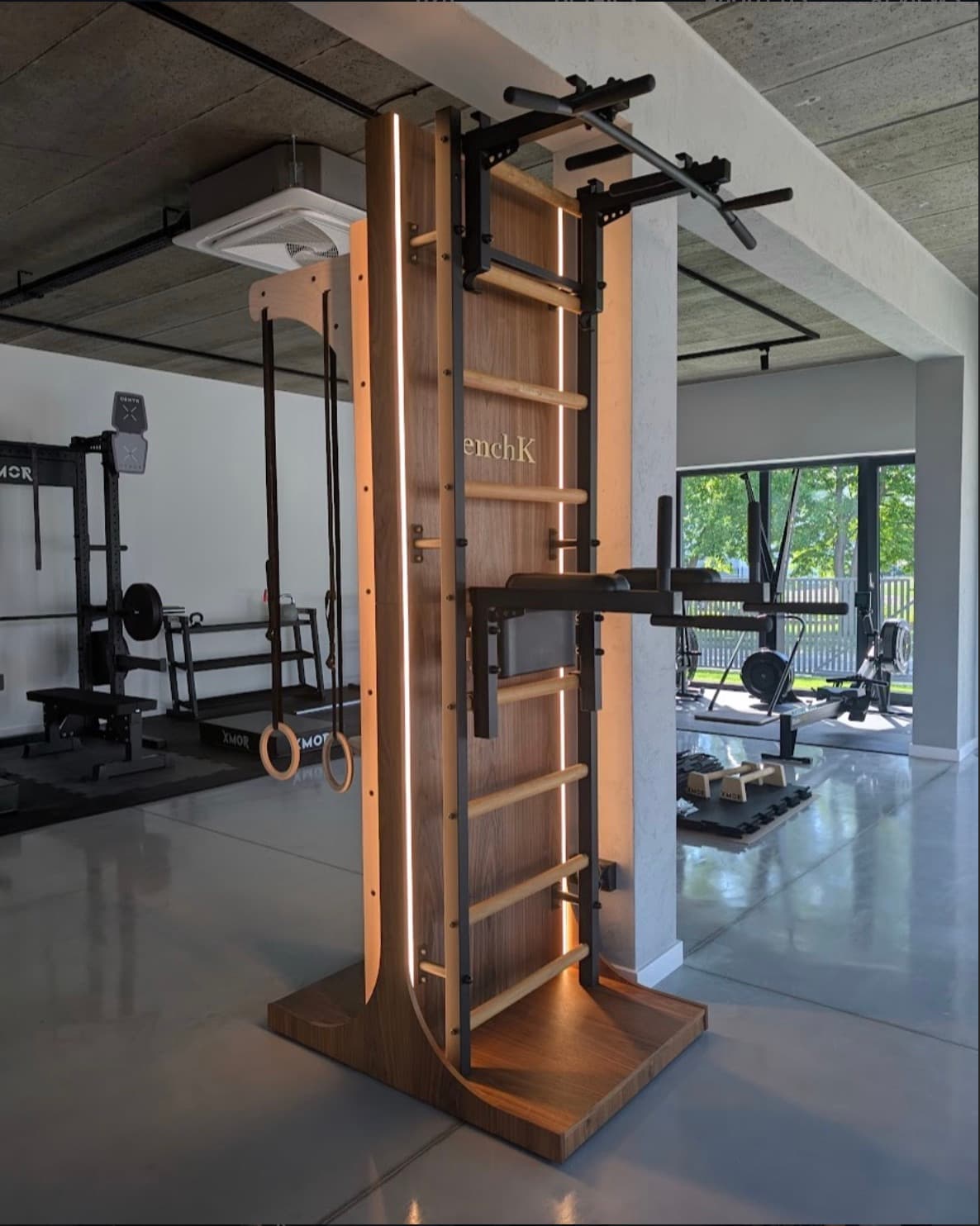 BenchK 700-series wall bars with pull-up bar and dip station in a showroom training space