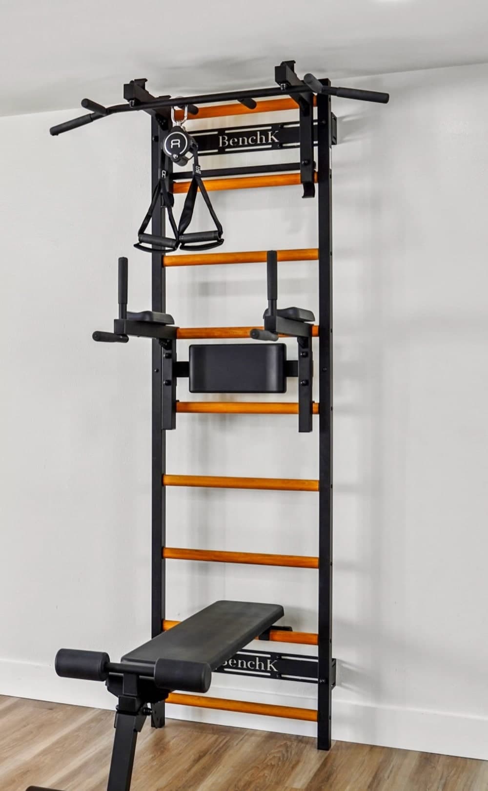 BenchK wall bar with ladder, pull-up bar, dip station, and bench installed